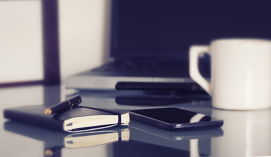 black smartphone between notebook and white ceramic mug, computer HD wallpaper