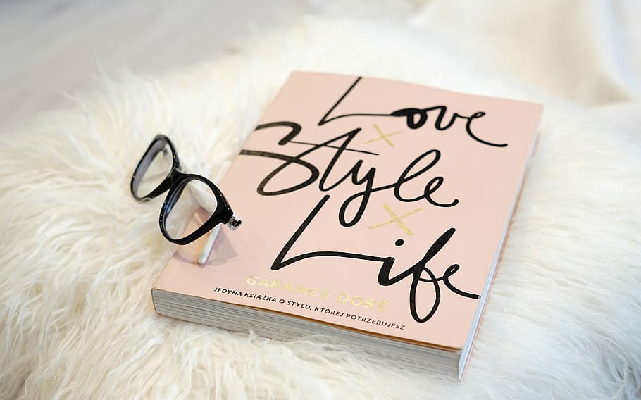 black eyeglasses on Love Style Life book, paper, business, document