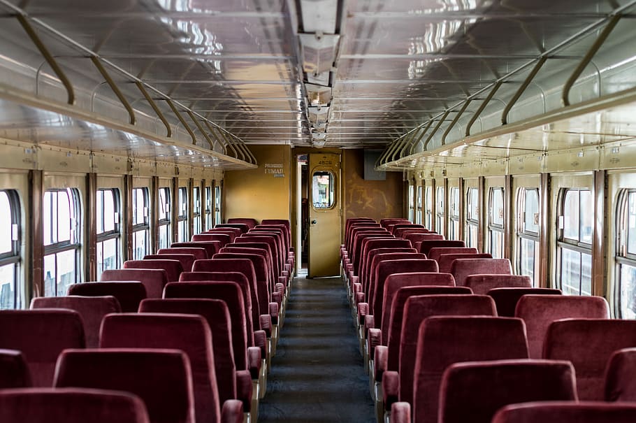 interior of train with red chairs, photo of train seat during daytime HD wallpaper