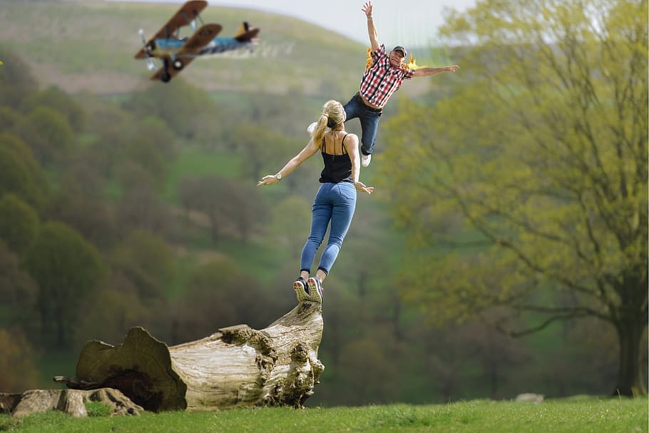man and woman on a tree trunk during day time, plane crash HD wallpaper