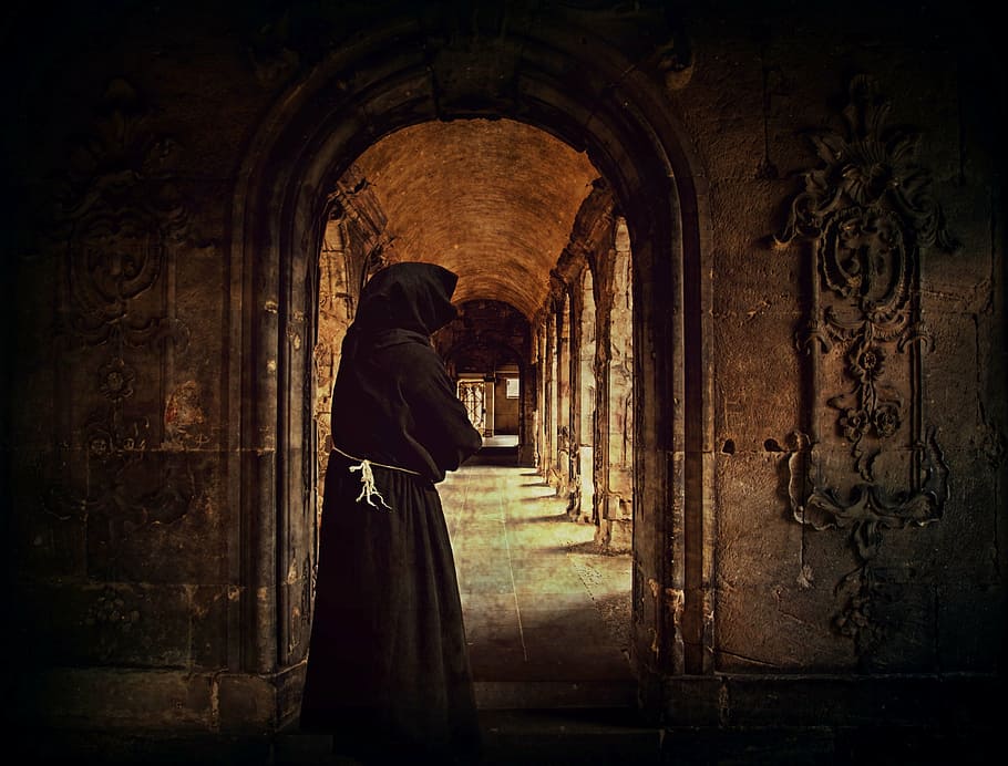 person wearing black hoodie top photo, monk, man, monastery, archway