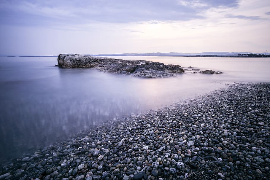 stony beach during cloudy day, rock formation on body of water, HD wallpaper