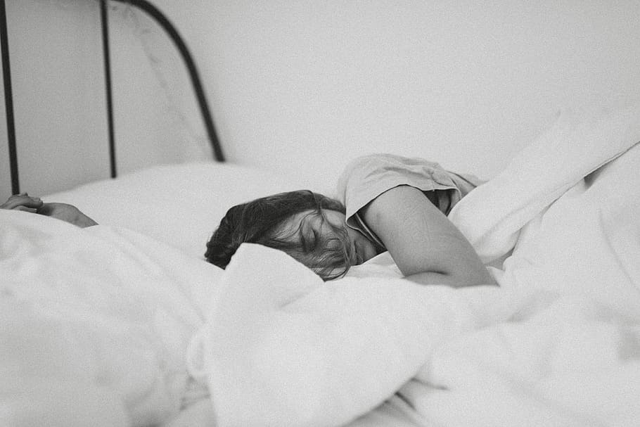 grayscale photo of sleeping woman lying on bed, grayscale photography of person sleeping on bed HD wallpaper