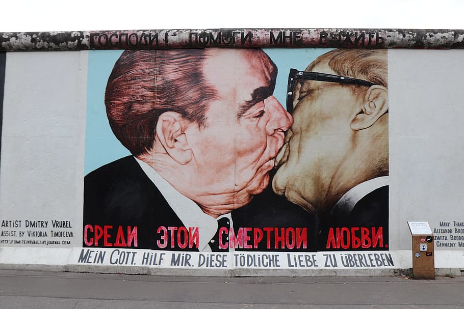 men's black suit photo, kiss, east, side, gallery, berlin, berlin wall