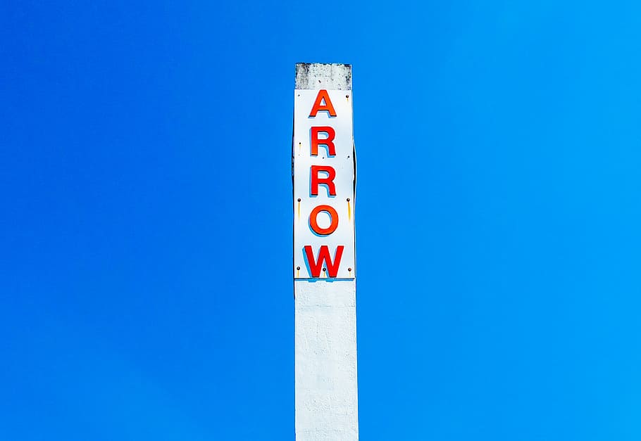 Arrow signage under blue sky, pole, industrial, no people, communication HD wallpaper