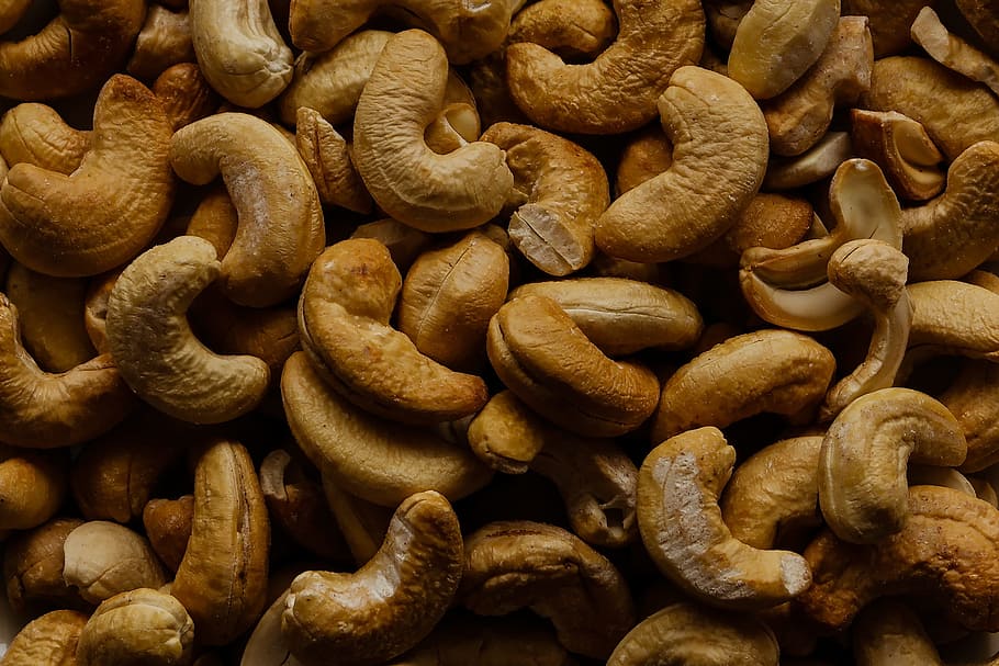 food photography of bunch of cashew nuts, snack, roasted, cashews