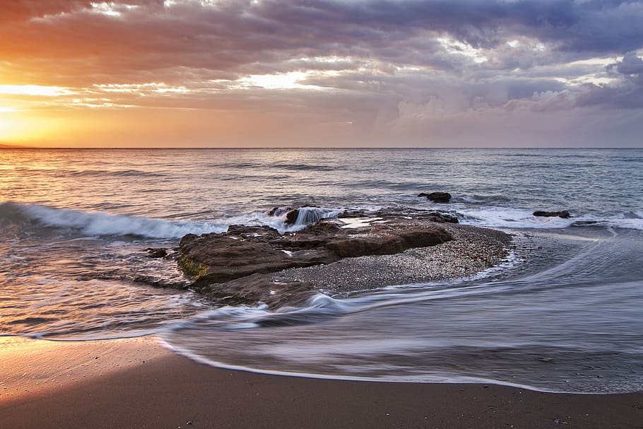 brown stone near seashore during sunset, brown rock formation on body of water during daytime HD wallpaper