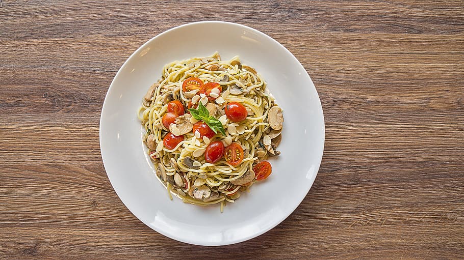 pasta food dish on white ceramic plate, mass, folder, tomato