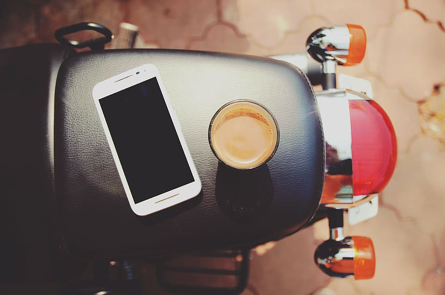 flat lay photography of white Android smartphone beside black mug filled with brown liquid, HD wallpaper