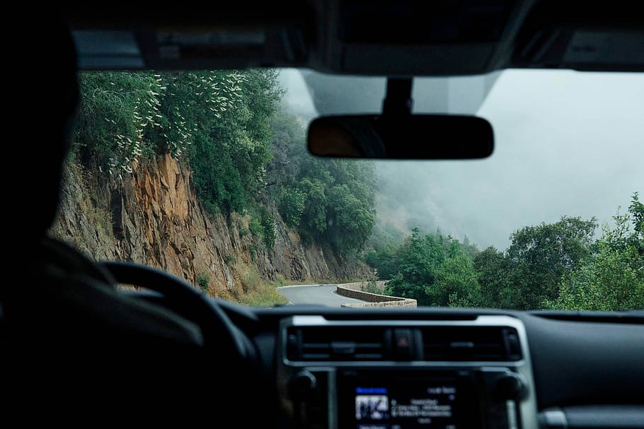 person driving vehicle beside cliff during daytime, person driving vehicle on road beside mountain, HD wallpaper