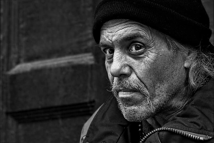 grayscale photo of man in jacket and beanie hatt, people, homeless