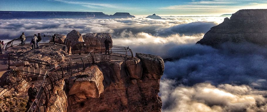 aerial photography of rock formation, grand canyon, cloud inversion