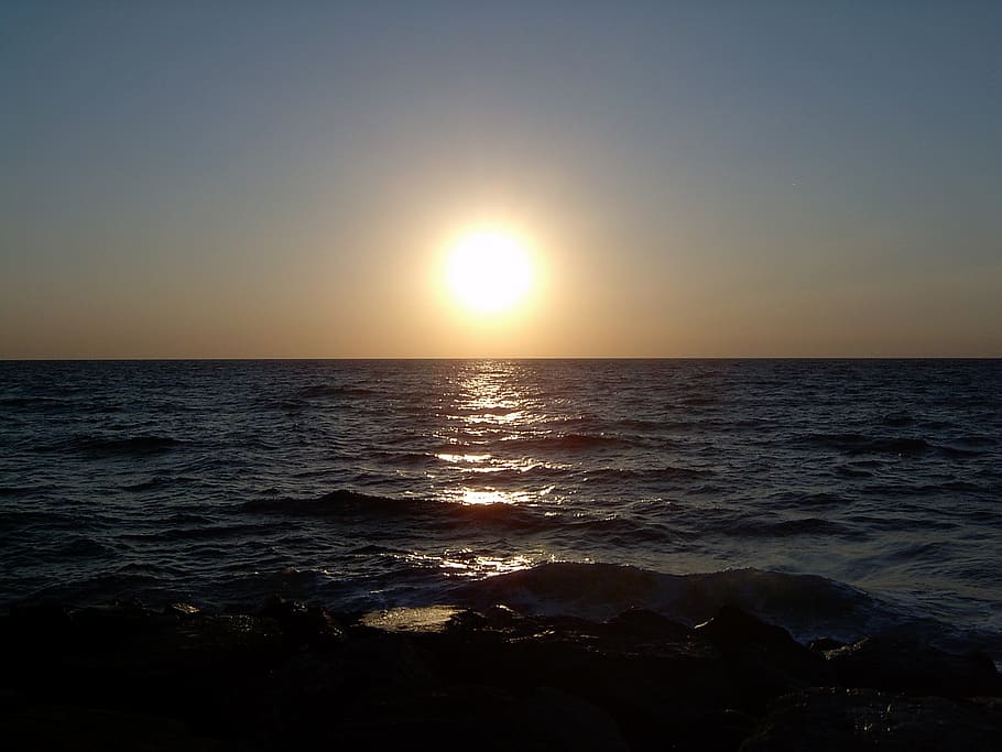 sun, sea, horizon, sunset, haze, evening, setting sun, wave HD wallpaper