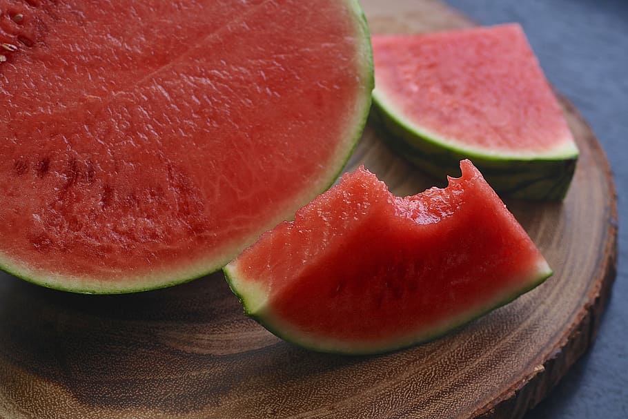 sliced watermelon on brown wooden surface, fruit, food, nutrition