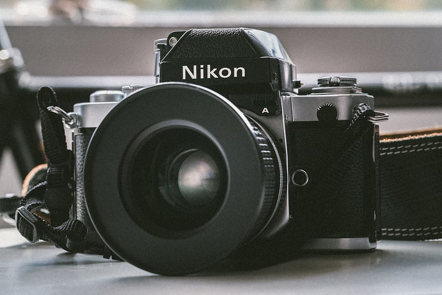 black Nikon milc camera on white panel, black Nikon DSLR camera, HD wallpaper