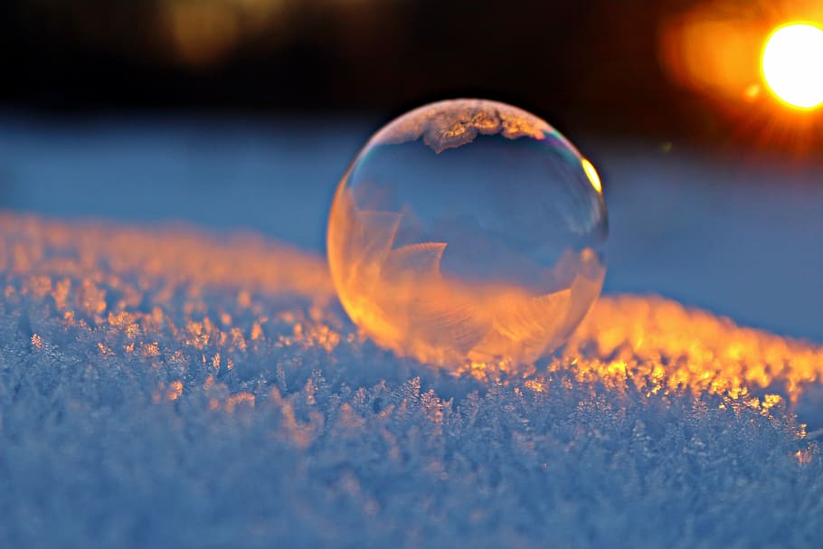 selective focus photography of clear ball on white surface, soap bubble