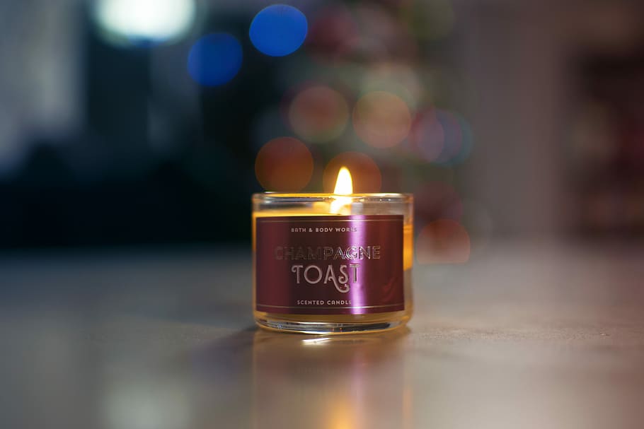 lighted Toast candle on gray panel, Toast votive candle selective focus photography HD wallpaper