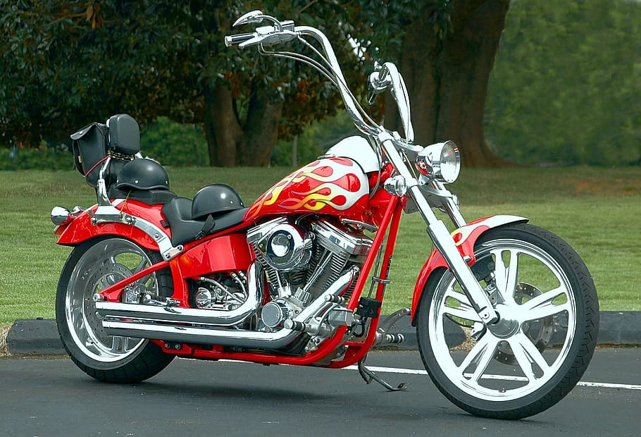 red and black chopper motorcycle on road, shiny, clean, tires