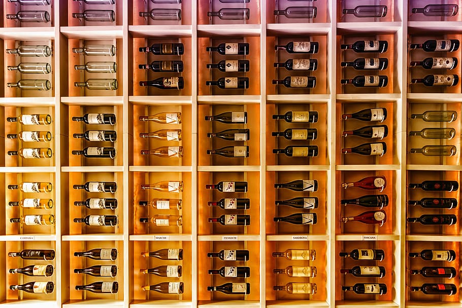 Wine bottles being kept in large rack for storage, food/Drink HD wallpaper