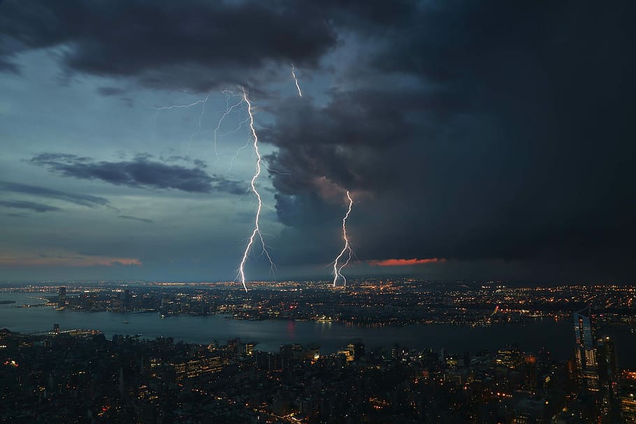 city skyline under lightning at night, thunderstorm during night time HD wallpaper