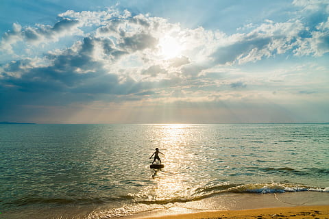 child on floating device on beach, boy, sand, sunset, tropical HD wallpaper