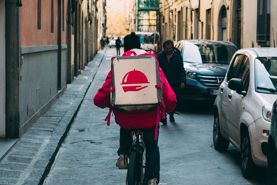 man riding bicycle on street during daytime, foodora, bike, delivery
