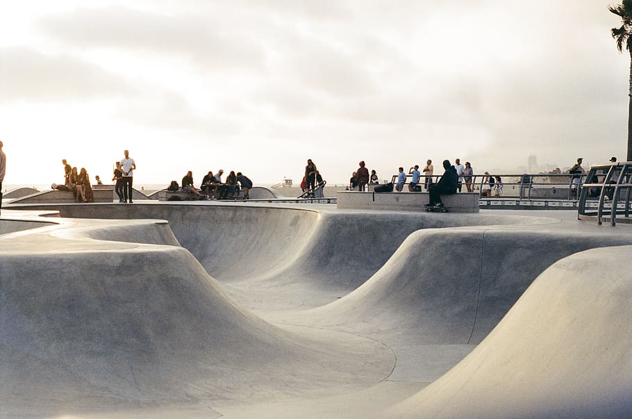 photo of gray skate park, half-pipe, skateboarding, skaters, sports