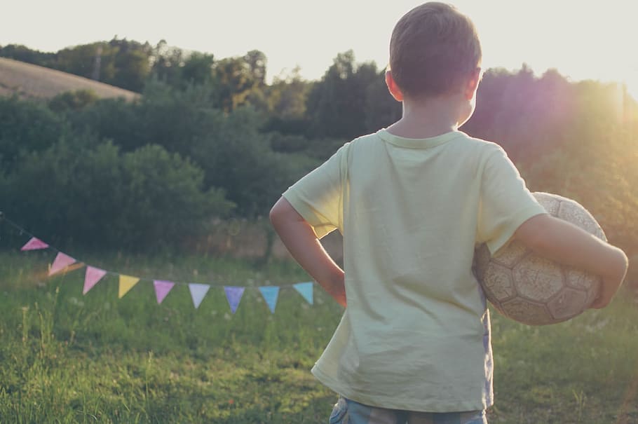 boy holding soccer ball, child, kid, playing, sports, sunshine HD wallpaper