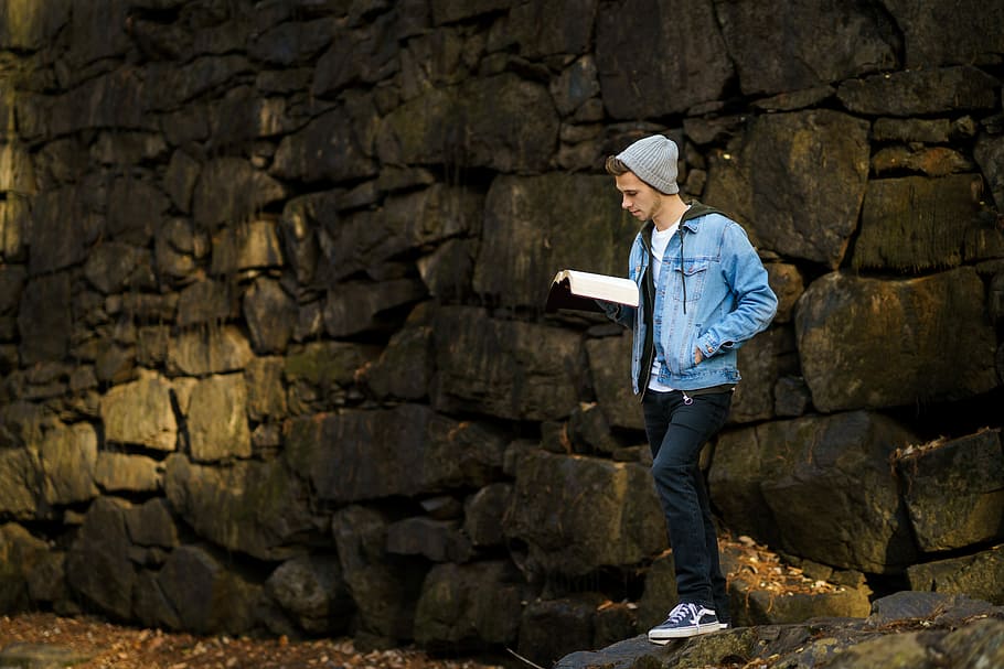 Hd Wallpaper Man Reading Book Beside Wall Man Standing Near Stone While Holding Book