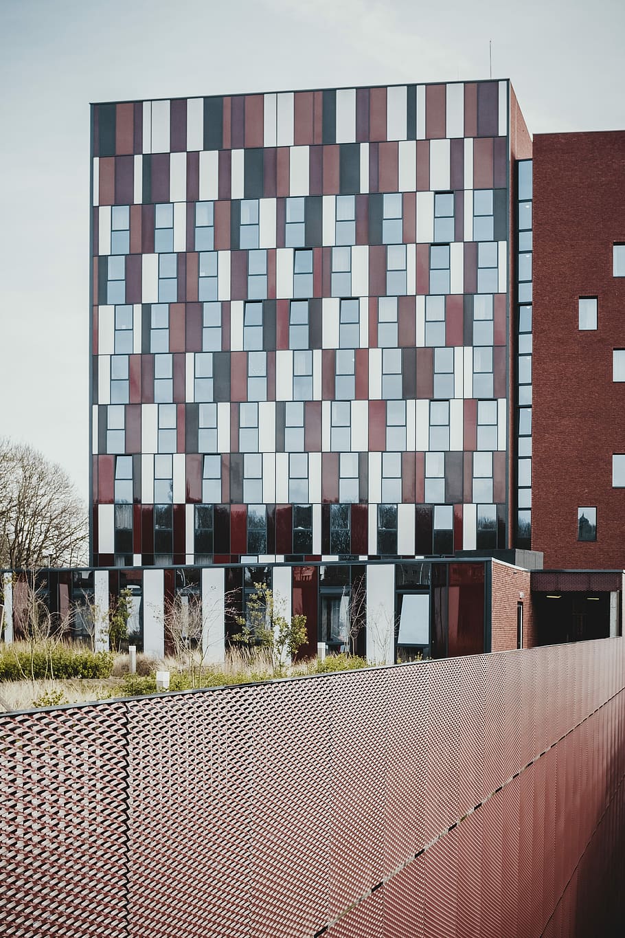 red painted building, photo of white and brown concrete building during daytime HD wallpaper