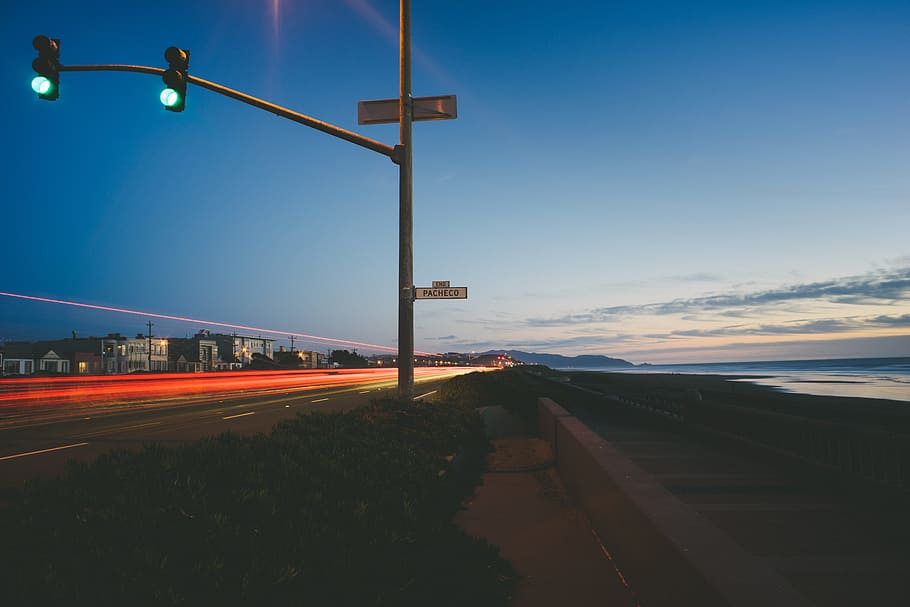 traffic light turned into green near baywalk during daytime, timelapse photo of car HD wallpaper