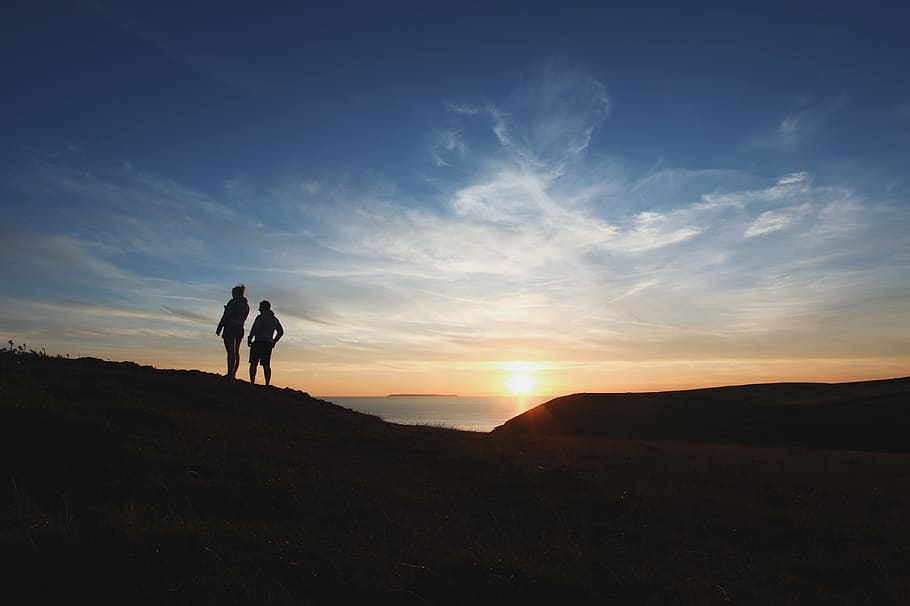 two person silhouette photography, silhouette of person standing on mountain HD wallpaper