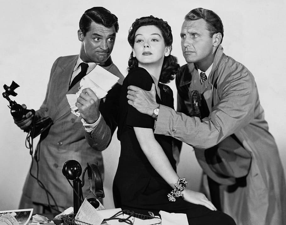 grayscale photo of woman between two men, cary grant, rosalind russell