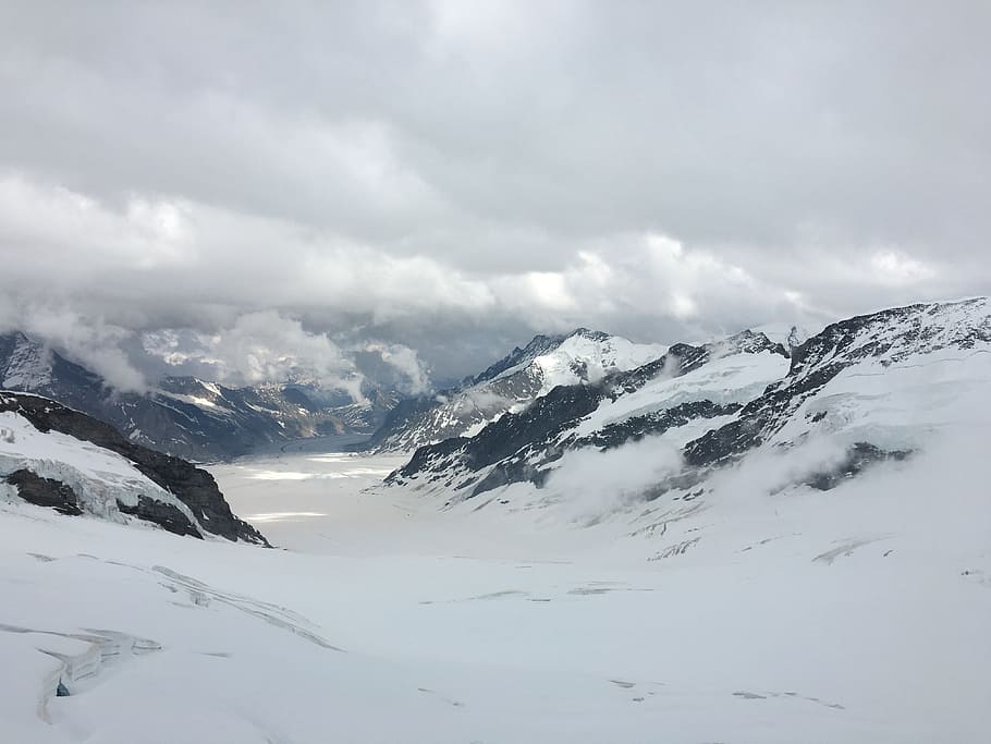 mountain cover by snow, snow covered mountains under cloudy sky during daytime HD wallpaper