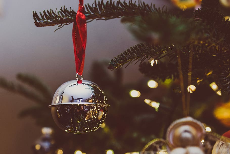 bokeh photo of gray bauble, close up photo of silver-colored bell ornament hang on pine tree HD wallpaper