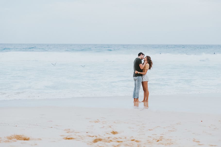 man and woman standing in seashore during daytime, ocean, water HD wallpaper