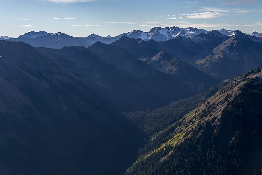 grass covered mountains during daytime, mountains taken under clear sky during daytime HD wallpaper