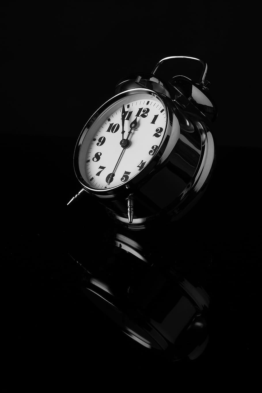 white and black table alarm clock, black and white, reflection