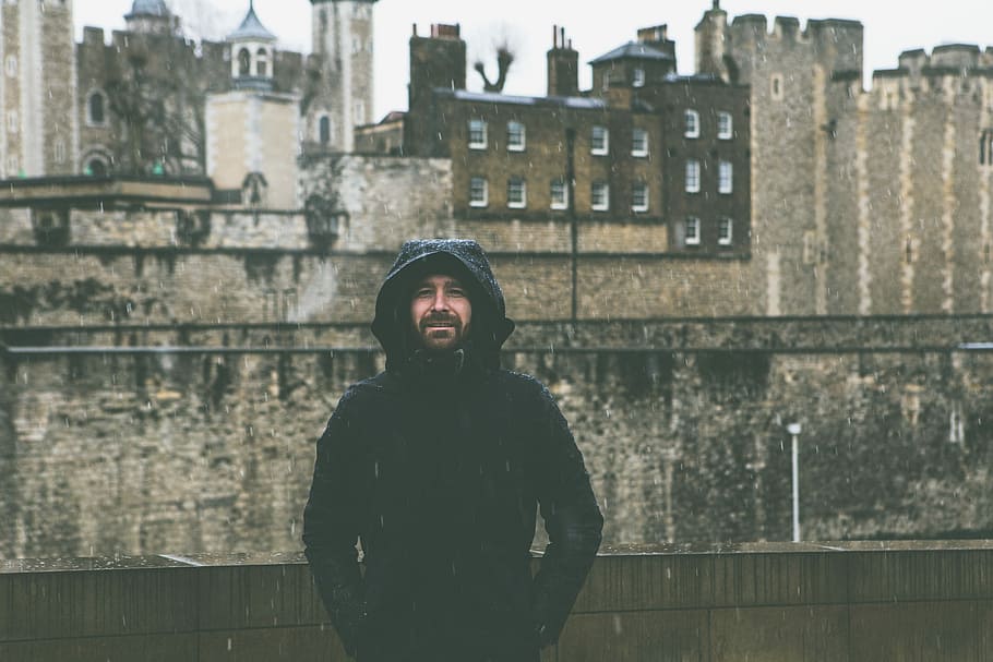 man wearing black hoodie standing in front of wall, portrait, HD wallpaper