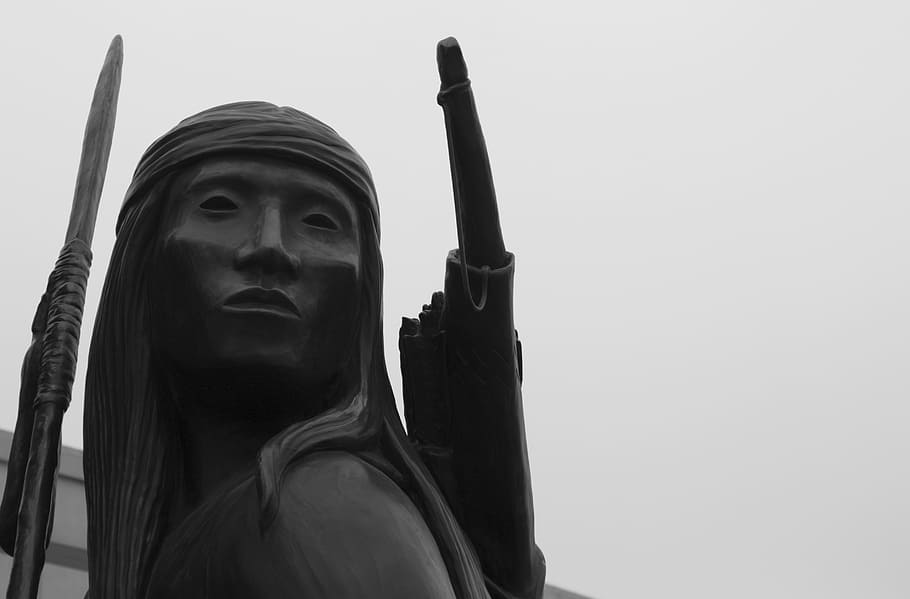 close-up photo of black statue at daytime, indian, warrior, sculpture
