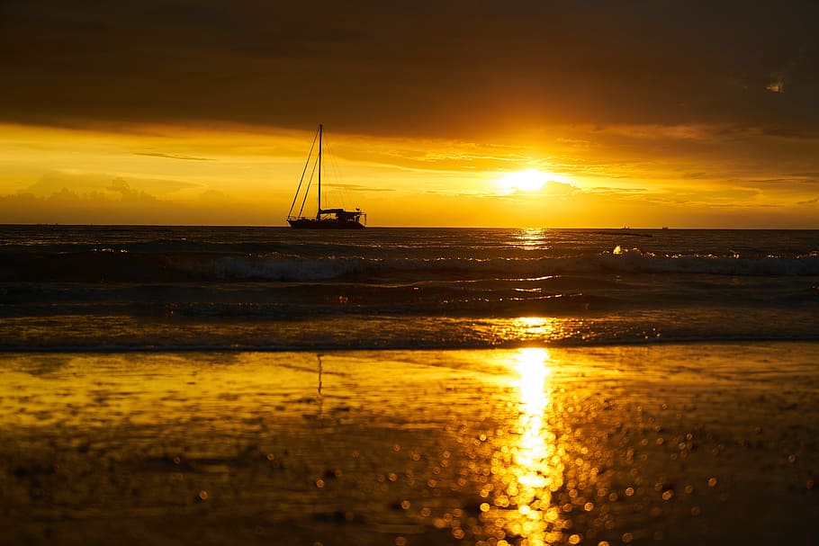 silhouette of sailboat on body of water during sunset, solar HD wallpaper