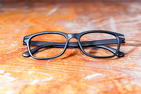 selective focus photography of black framed eyeglasses, brown HD wallpaper