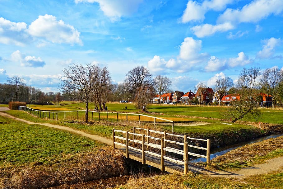 brown wooden bridge under white and blue skies, field, footpath HD wallpaper