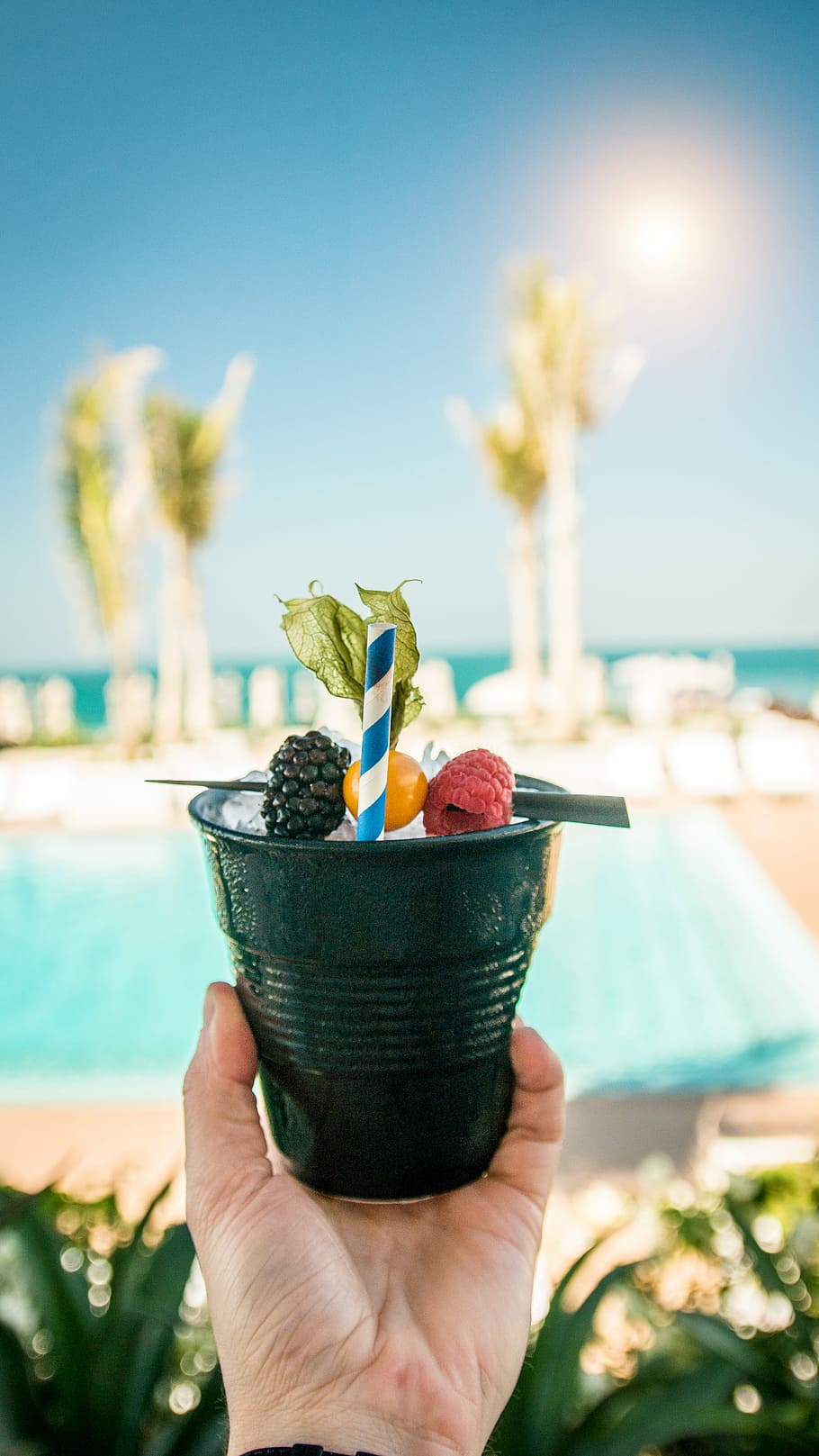 person holding iced beverage with fruits, drink, hand, refreshing HD wallpaper