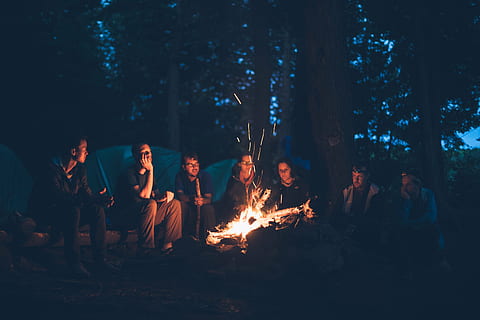 bonfire surrounded by group of men near tents and trees, camping HD wallpaper
