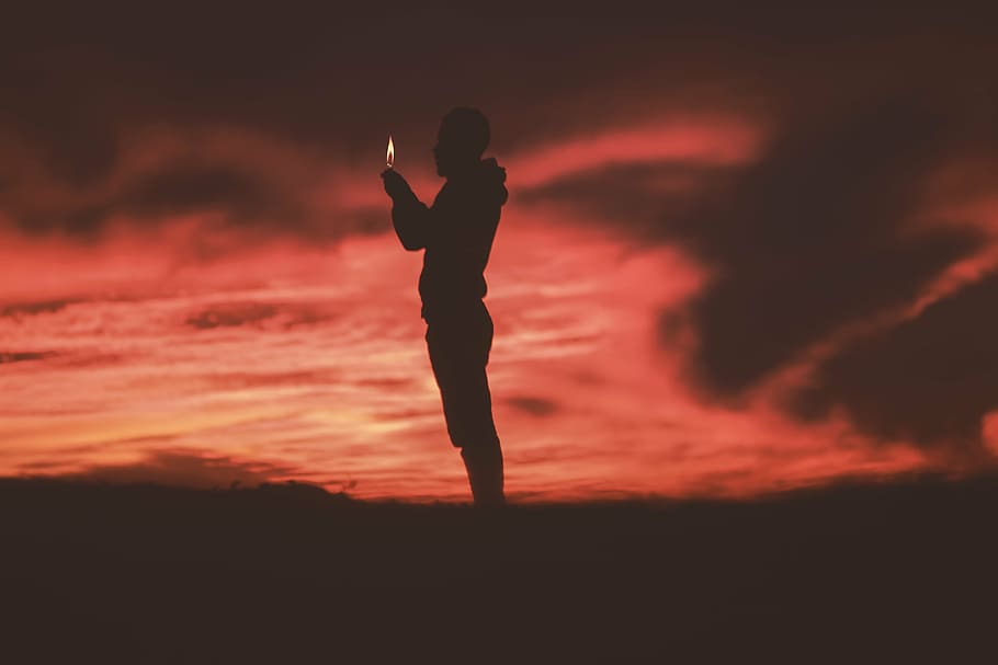 man standing on field, people, fire, light, silhouette, travel HD wallpaper