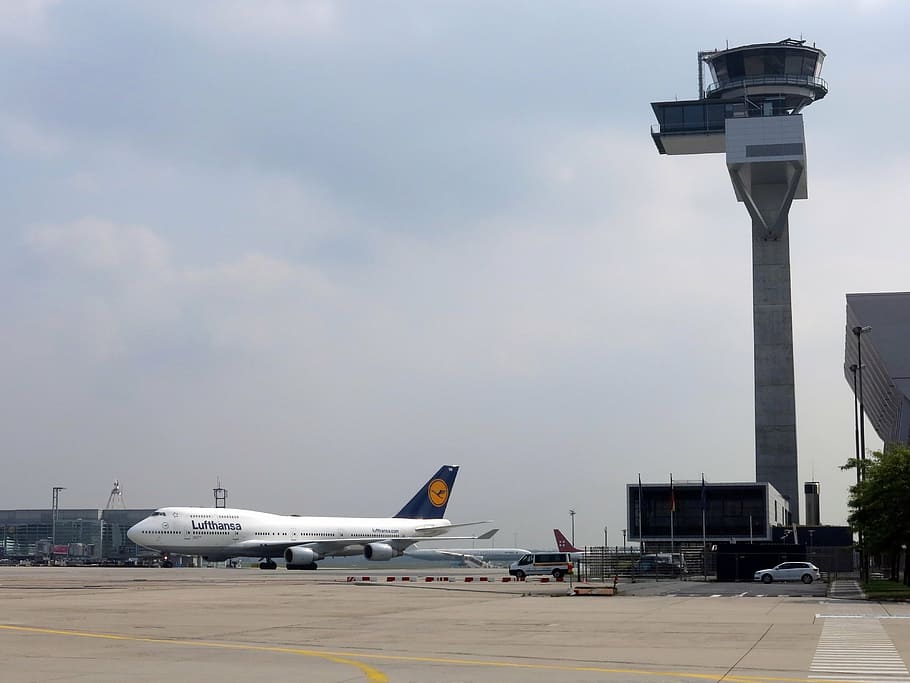 white airliner on pavement, lufthansa, tower, air traffic control