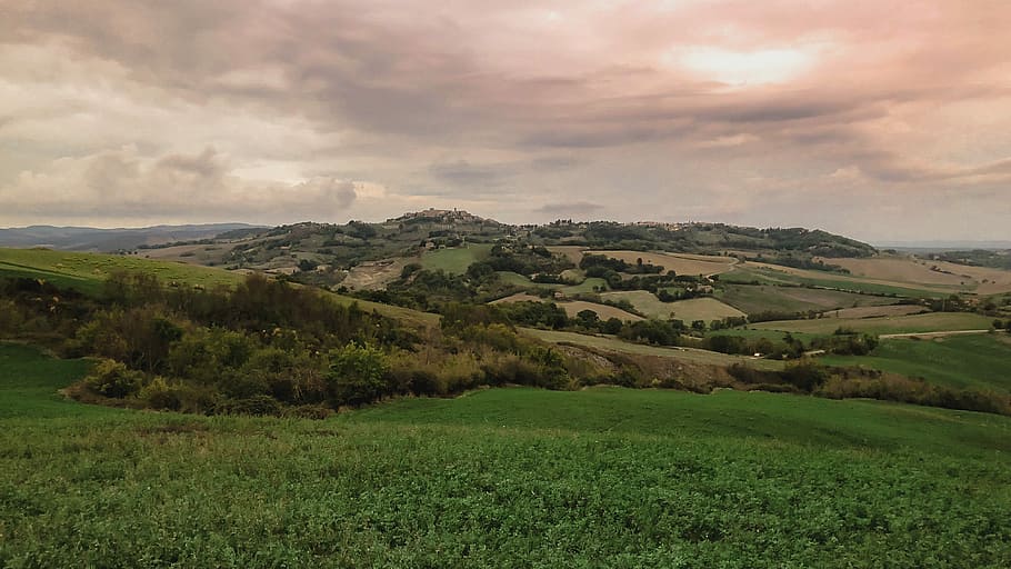 landscape photo of green land, green field under cloudy sky during daytime HD wallpaper