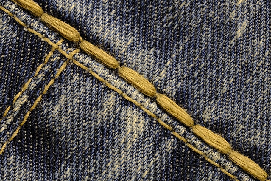closeup photo of blue denim cloth, seam, thread, yarn, sew, fabric