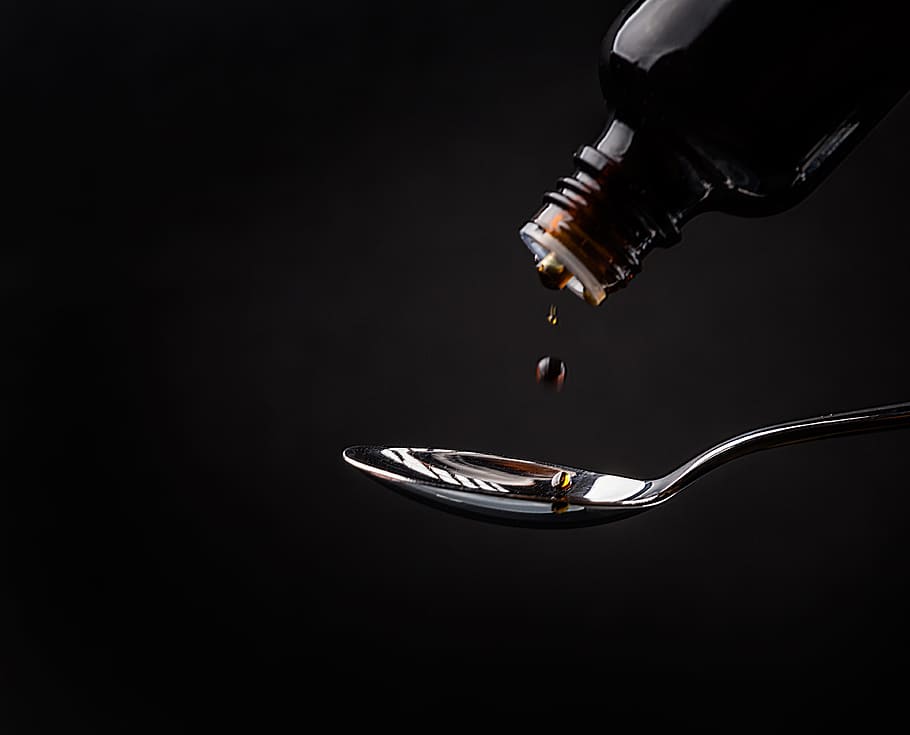 liquid from bottle about to drop to spoon, cough syrup, medicine, HD wallpaper